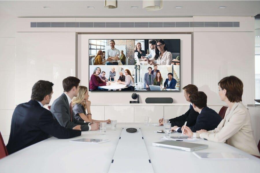 Corporate Employees in a Meeting Room Viewing a Digital Signage Display with Samsung VX Technology