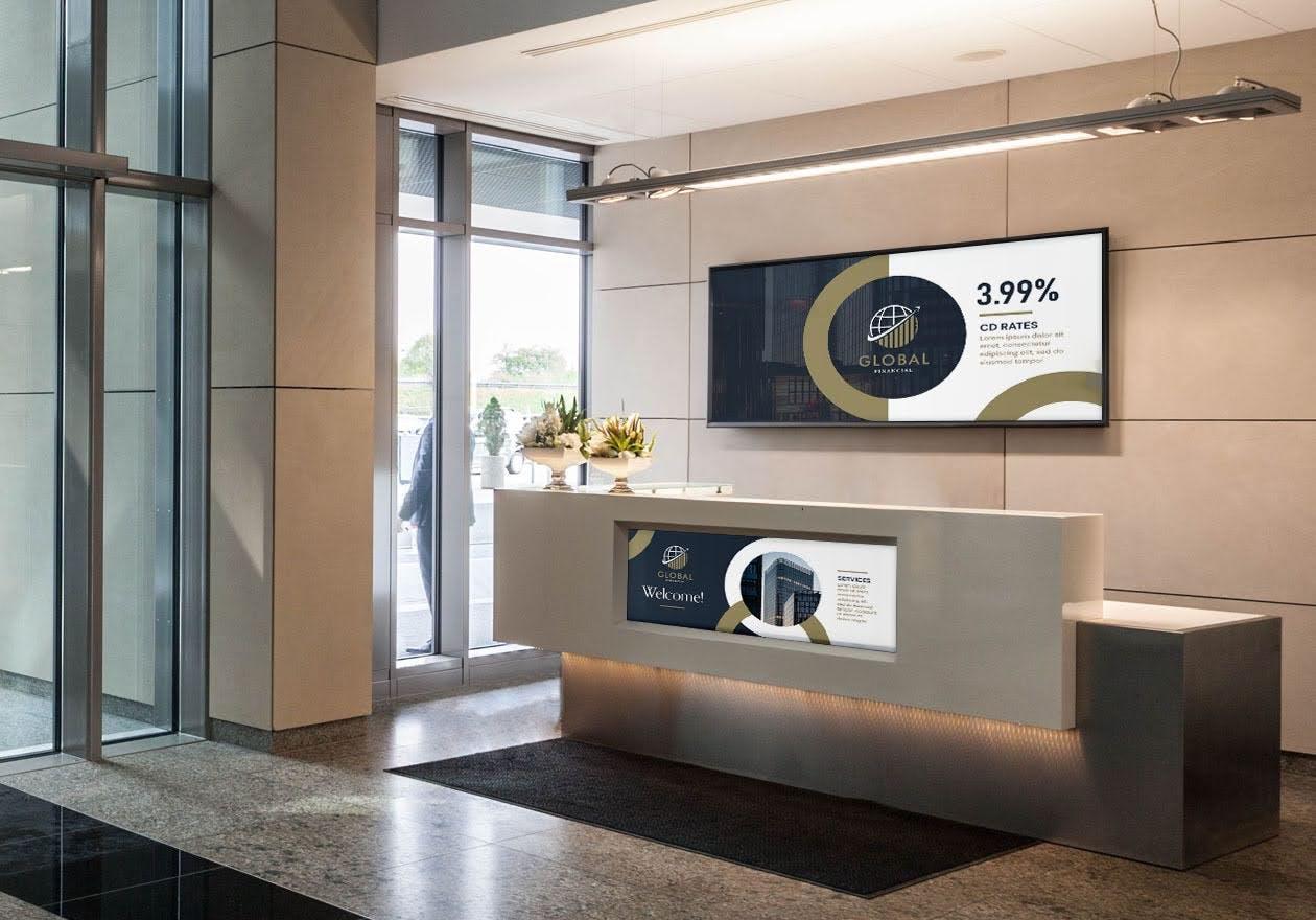 reception desk at a bank featuring digital signage
