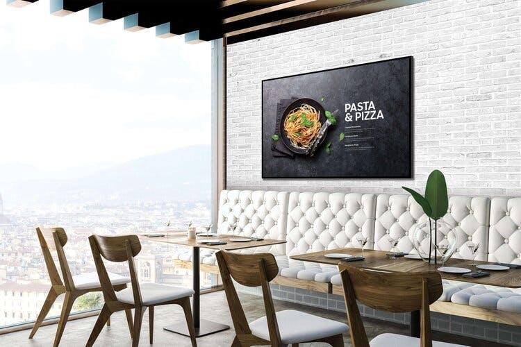 An Italian food menu appears via display solutions in a contemporary restaurant
